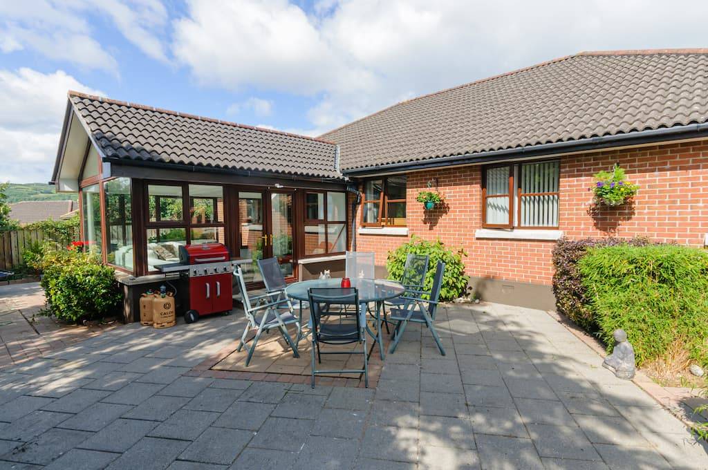 a conservatory roof with table and chairs