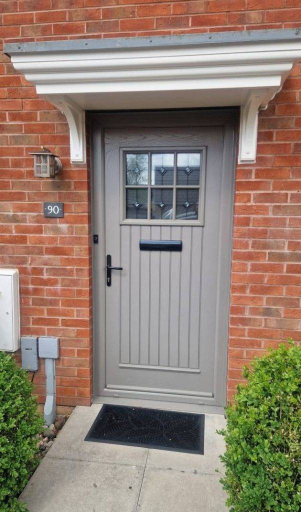 New grey door on a brick house
